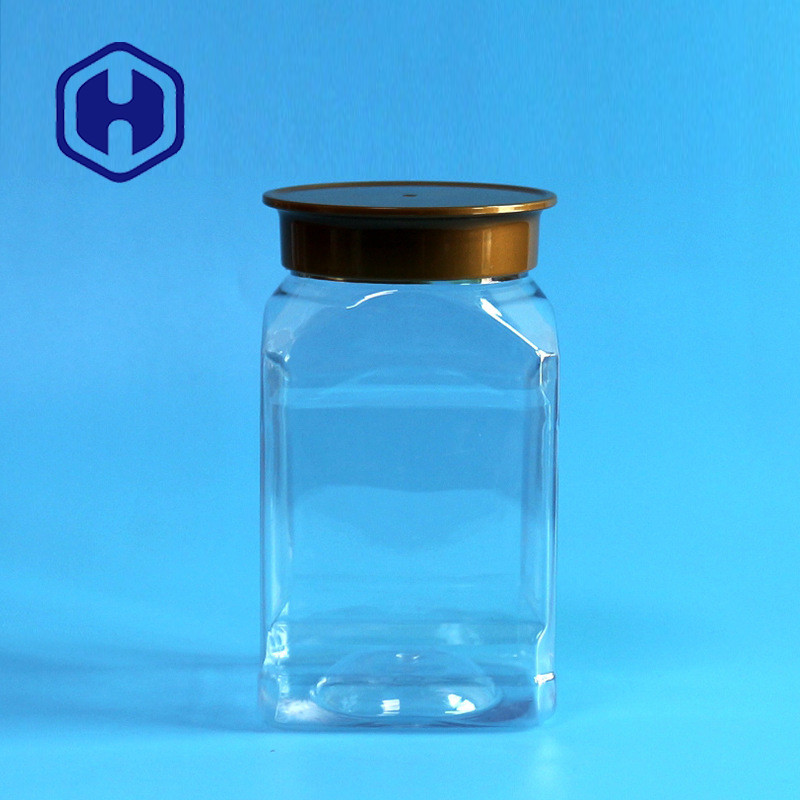 os núcleos 420ml esquadram frascos plásticos da boca larga com o produto comestível das tampas